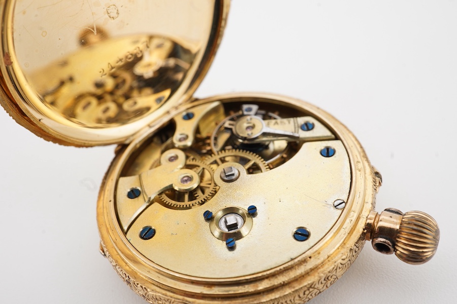 A lady's early 20th century engraved 18k lady's keyless open faced fob watch, with Roman dial, case diameter 32mm, gross weight 26 grams.